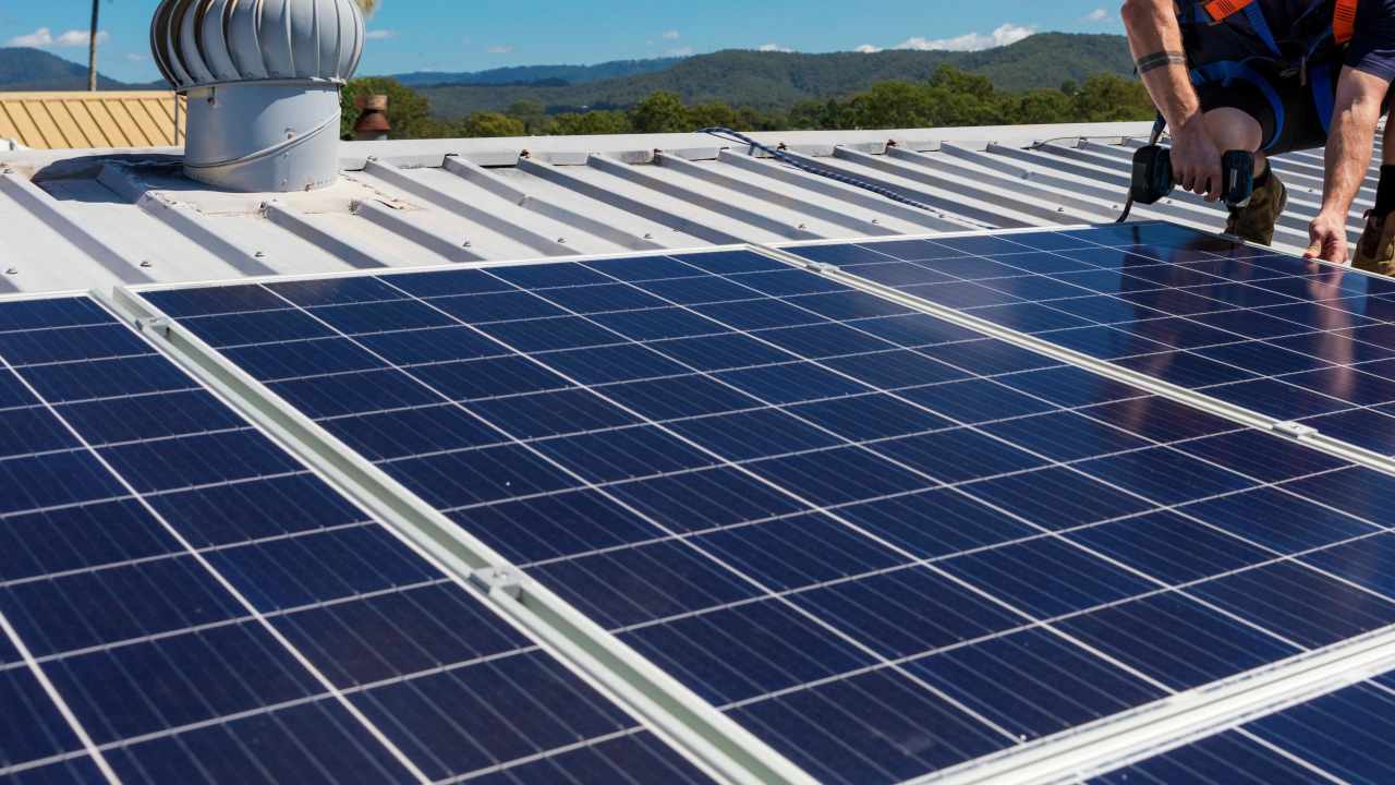 Man attaching solar panels